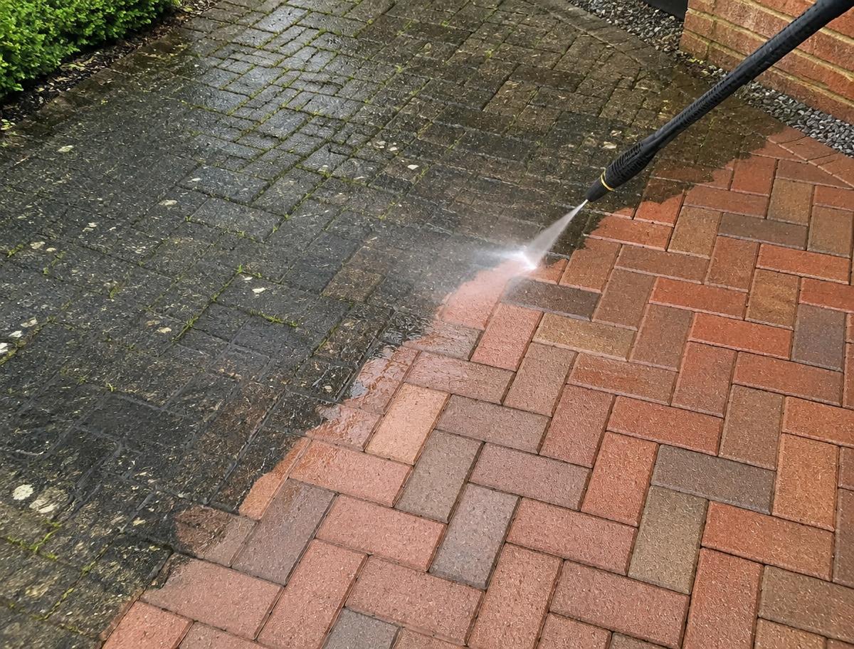 Driveway half cleaned by pressure washing